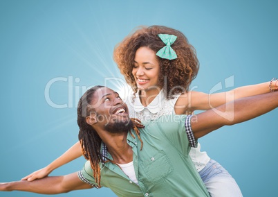 Couple against blue background with flare