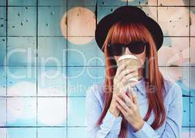 Woman with coffee against tiles with bokeh