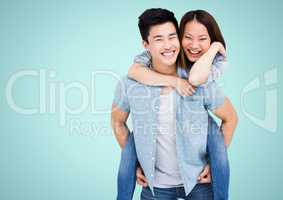 Composite image of happy Asian couple against blue background