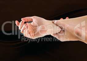 Composite image of woman hands restraining against dark background