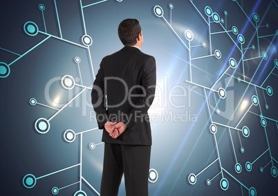 Composite image of Businessman Standing and looking at Graphic