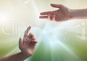 Composite image of Hands against illuminated green background
