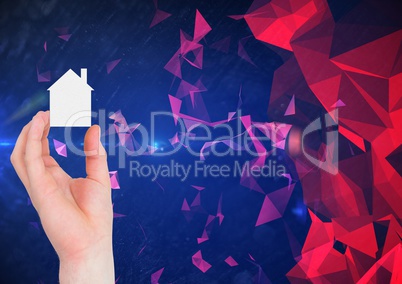 Composite image of Hand Holding House against Broken Polygons and blue background