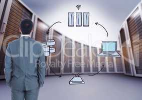 Composite image of Businessman Standing and looking at icons against big folders