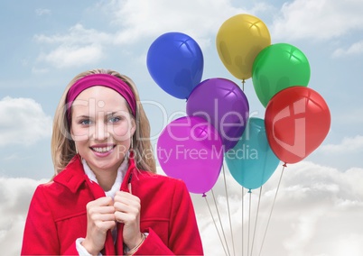 Composite image of Woman smiling against Balloons in sky