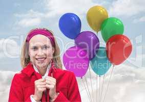 Composite image of Woman smiling against Balloons in sky