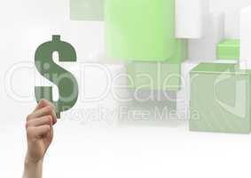 Composite Image of a Hand holding Money against Green Building blocks against a white background