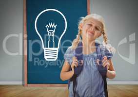 kid and blue blackboard with lightbulb against a grey background