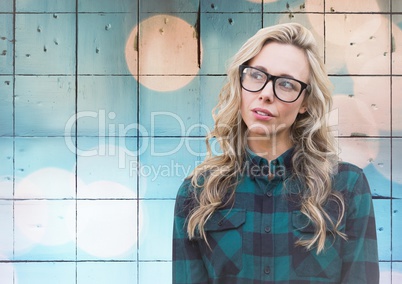 Woman with glasses against tiles with bokeh background