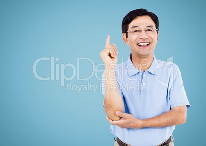 Happy Man raising arm and smiling against a light blue background