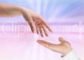 Composite of two hands against a colorful background