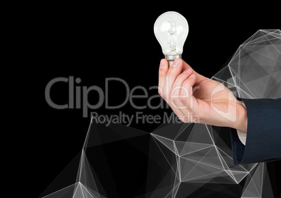 Composite image of Hand Holding Lightbulb against black background