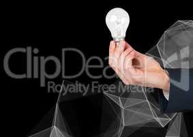 Composite image of Hand Holding Lightbulb against black background