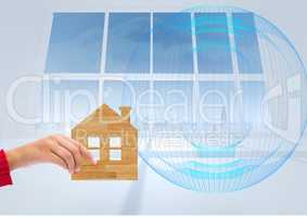 Composite image of Hand holding wood Home icon against Windows