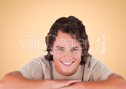 Happy man smiling at camera against a neutral background
