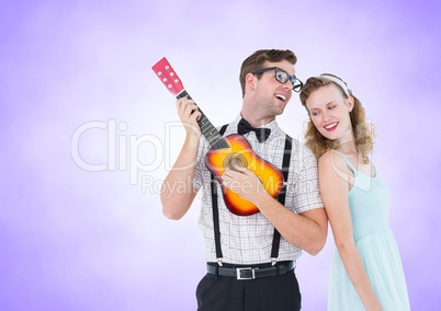 Happy couple playing guitar against a lavender background