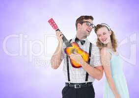 Happy couple playing guitar against a lavender background