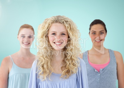 Girls Portrait smiling at camera against a light blue background
