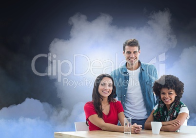 Smiling People group seating at Table against Clouds against a dark blue background