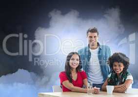 Smiling People group seating at Table against Clouds against a dark blue background