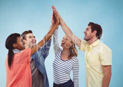 Group of Friends clapping each other hands against a blue background