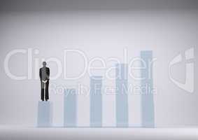 Businesswoman standing on graph against grey background