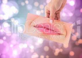Composite image of hand holding woman smile picture against bright colored background
