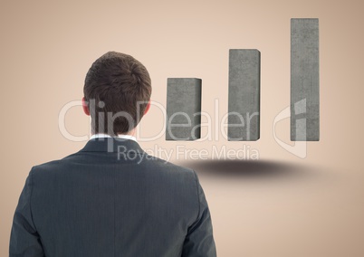 Composite image of Business man Standing looking at Graph against a neutral background