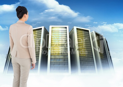 Composite image of Business woman Standing and looking at big folders