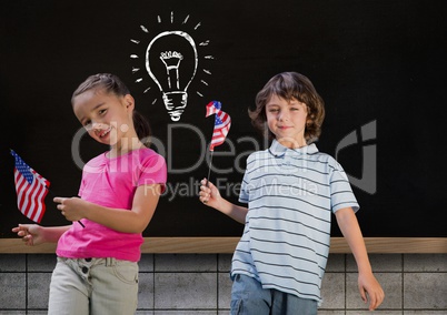 kids and blackboard with lightbulb against black background