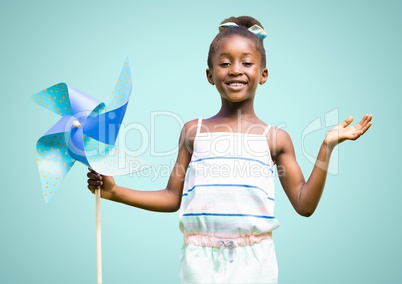 Happy Kid Girl having Fun against a light blue ackground