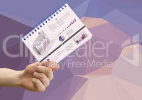 Composite image of Hand holding Notepad with Statistics Charts against graphic purple background