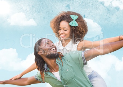 Composite image of Simling couple against blue sky