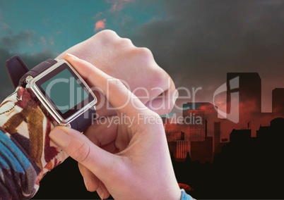 Composite image of Hand adjusting smart watch against city view