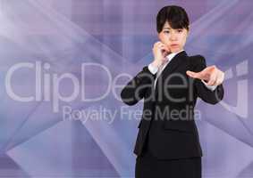 Businesswoman using phone and pointing her hand against purple background