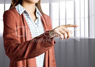 Woman Hand pointing against a grey background