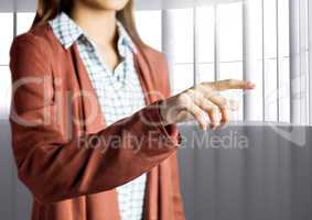 Woman Hand pointing against a grey background