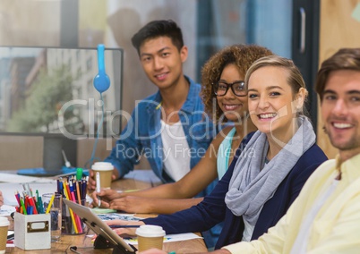 Team Worker smiling at camera against a office background