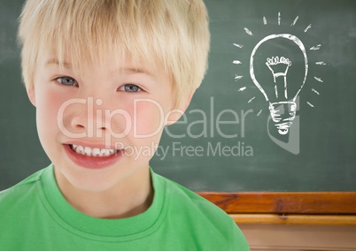 kid and blackboard with lightbulb against a black background