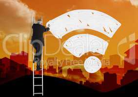 Composite image of Businessman on ladder drawing WiFi icon against city