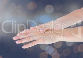Composite image of Hands retaining against bright background