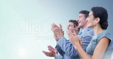 Composite image of people Clapping and smiling against blue background