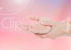 Composite image of Hands against pink background