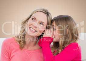 Mother and Daughter Smilling against a neutral background