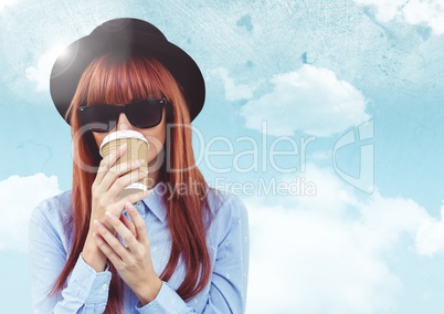 Woman with coffee against sky with flare background