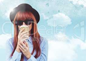 Woman with coffee against sky with flare background
