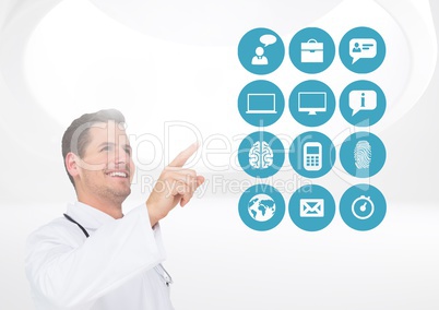 Doctor pretending to touch digitally generated medical icons