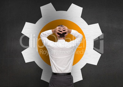 Stressed man standing against setting sign on grey background