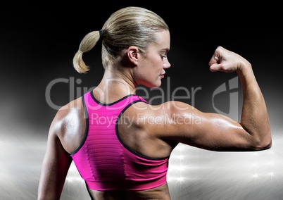 Fit woman flexing muscles