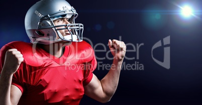 Digitally generated image of american football player cheering with clenched fist